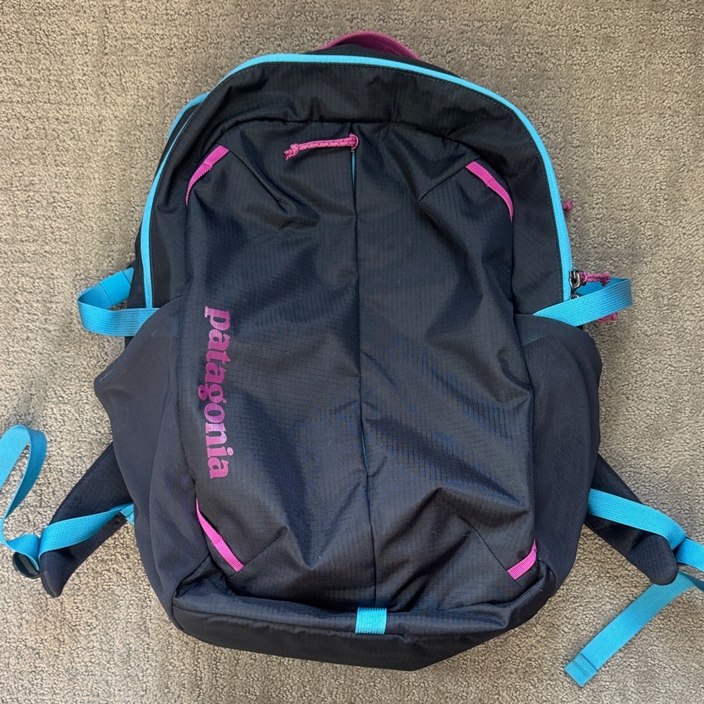 Patagonia Black Backpack with Pink and Blue Highlights